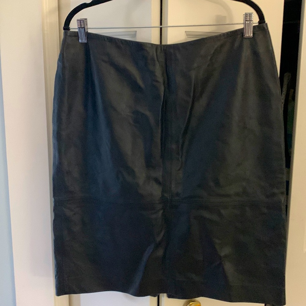 Women’s size 12 W leather line skirt. Knee length. Small slit in the back.